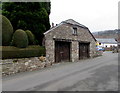 Wooden doors near topiary in Crickhowell