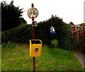 Yellow litter bin above Caerphilly Road, Bassaleg