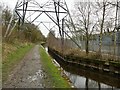 Canal under an electricity pylon