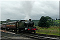 SJ9851 : Steam hauled train approaching Cheddleton in Staffordshire by Roger  D Kidd
