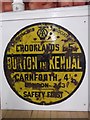 SD5376 : Old circular AA Sign in the Memorial Hall, Burton in Kendal by Milestone Society