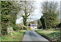 Cottage seen along narrow lane