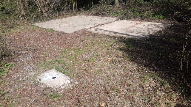 Base of former mobile phone mast in Cheriton Wood