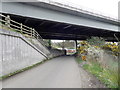 Craigmore Road passing West-northwest beneath A1 Viaduct