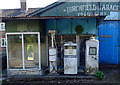 Old petrol pumps outside garage, Much Wenlock