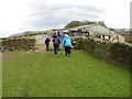 Field-edge footpath and walkers approaching Sixpenny Syke Farm