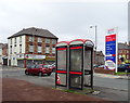 Pair of KX100 PLUS telephone boxes on Lowell Street