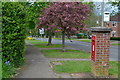 Brick pillar box and view down Hightown Road