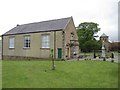 NY8837 : Upper Weardale Town Hall, War Memorial and St John's Church by Les Hull