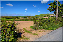 SS5628 : North Devon : Ploughed Field by Lewis Clarke
