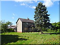 Boarded up cottage on Borras Road