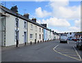 Long row of houses at the edge of a car park, Lampeter