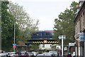 View of a Southeastern train crossing the bridge over Penge Lane