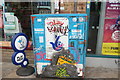View of a junction box covered in stickers and street art on Penge High Street