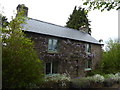 Cottage with Wisteria on its frontage near Clun