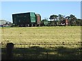 NY8962 : Trailers and hay turner at Watch Currock Farm by Oliver Dixon
