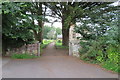 ST0042 : Gate into Carhampton church grounds by John C