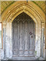 ST7253 : South door of Hemington's church by Neil Owen