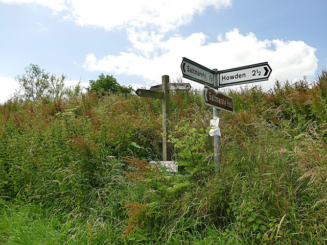 Footpath and road direction signs at Sand Hall