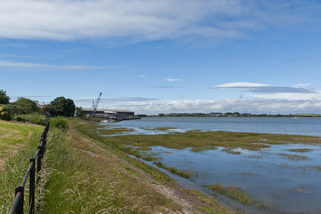 Looking along the seawall towards a slipway and warehouses at Glasson Dock