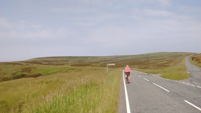 Cyclist Passes Road Junction