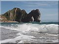SY8080 : West Lulworth: a wave breaks at Durdle Door by Chris Downer