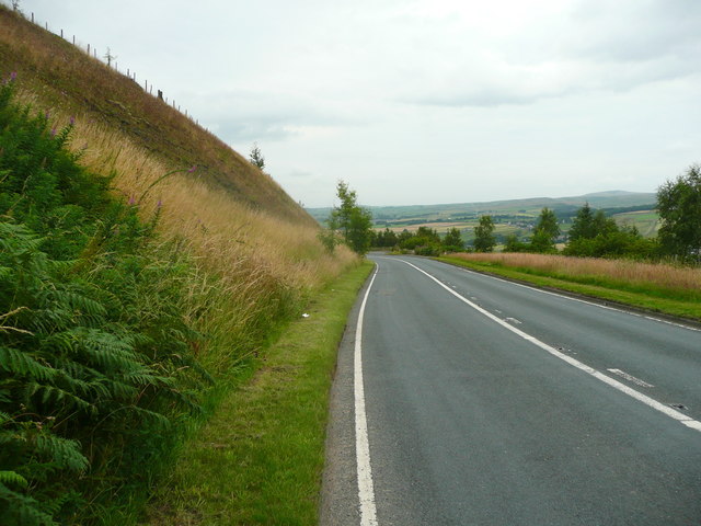 The A671 passing Dyneley Knoll, Cliviger