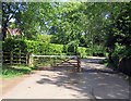 Gated road into Rolleston from New Inn