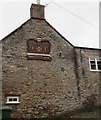 Crown depiction on a St Thomas Street side wall, Wells