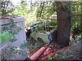 Abandoned and derelict old vehicles in a disused yard in Abersoch