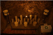TL7835 : View of a collection of candles in the fireplace in the cafe of Hedingham Castle by Robert Lamb