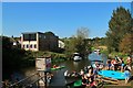 Canoes and wake boarders at River Rother