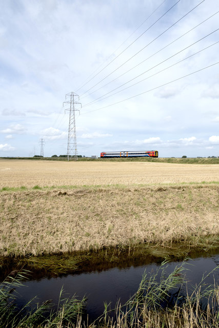 A class 158 crossing the fens