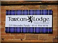 Sign for Tartan Lodge