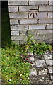 Benchmark on garage block on east side of Harris Road