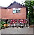 SO1500 : Wreaths on an Aberbargoed War Memorial wall by Jaggery