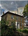 Early Victorian house with a hospital behind