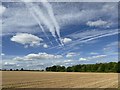 SK7864 : Blue sky above a ploughed field by Graham Hogg