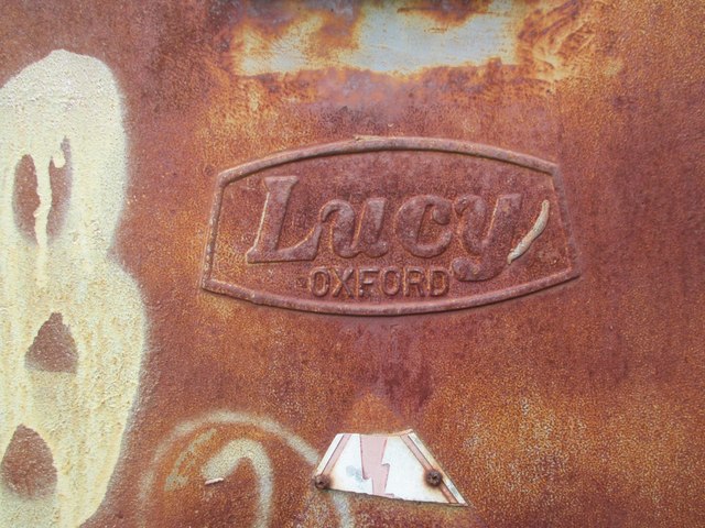 Close-up of Lucy Oxford box logo on Station Road, Llanfairfechan