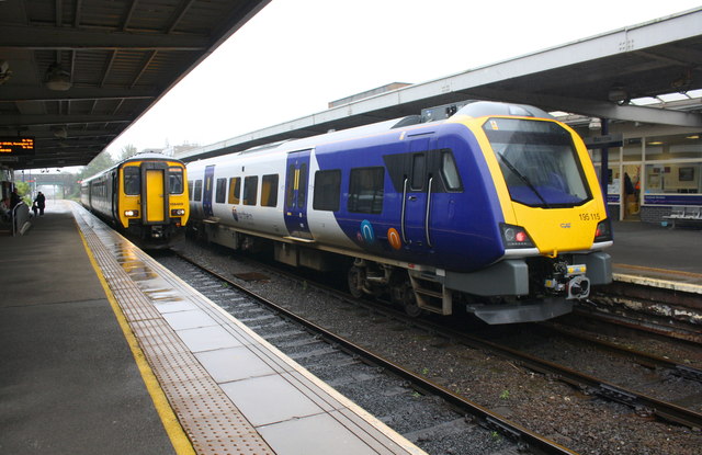 Old and new Northern DMU at a wet Barrow-in-Furness Station