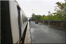 SD1780 : Diesel multiple unit number 156469 calls at a wet Millom Station by Roger Templeman
