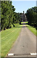 SK8932 : View along road through Harlaxton Park towards Harlaxton College by Roger Templeman