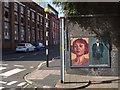 Posters under a railway bridge