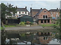 SP0343 : River Avon and a boarded up public house by Chris Allen