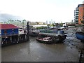 Houseboat village on the Thames at low tide