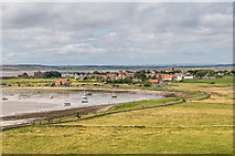 NU1241 : The Ouse and Holy Island village by Ian Capper