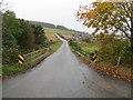 Minor road and bridge crossing Leochel Burn at Knockandoch