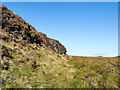 NR9880 : Walker descending beside low crag by Trevor Littlewood