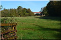 View along field to railway bridge