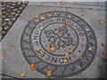 Motto set in Pavement in Market Place Cockermouth